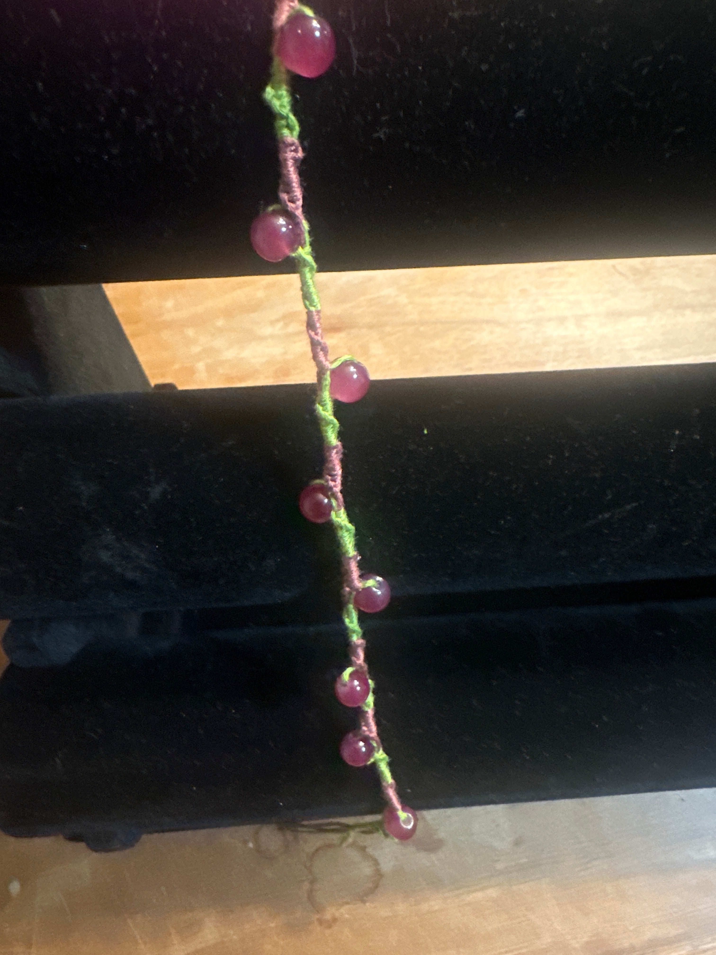 Spiral design bracelet with 9 glass baubles
