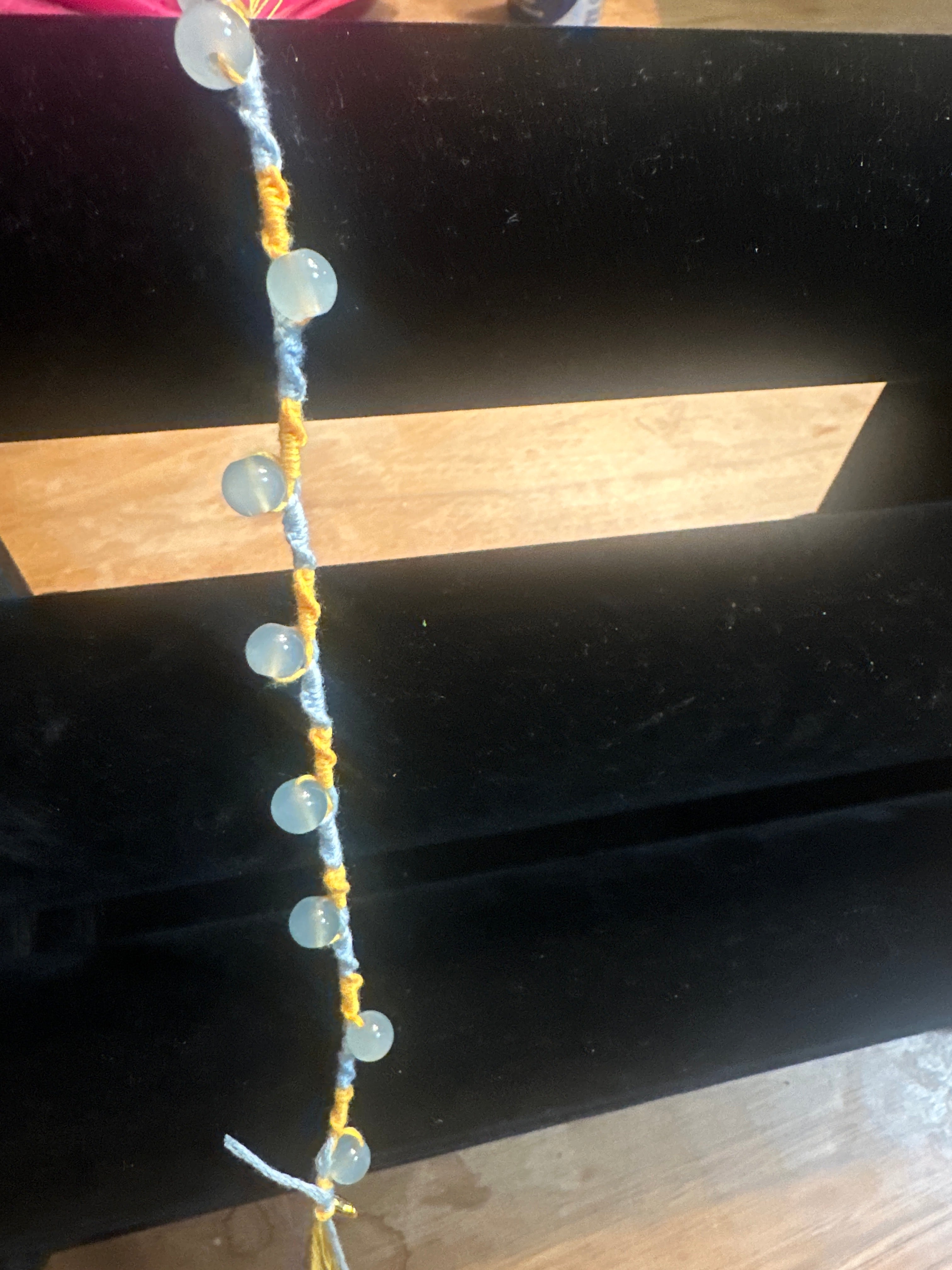 Spiral design bracelet with 9 glass baubles