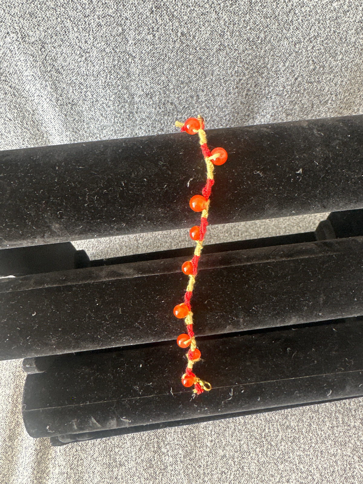 Spiral design bracelet with 9 glass baubles