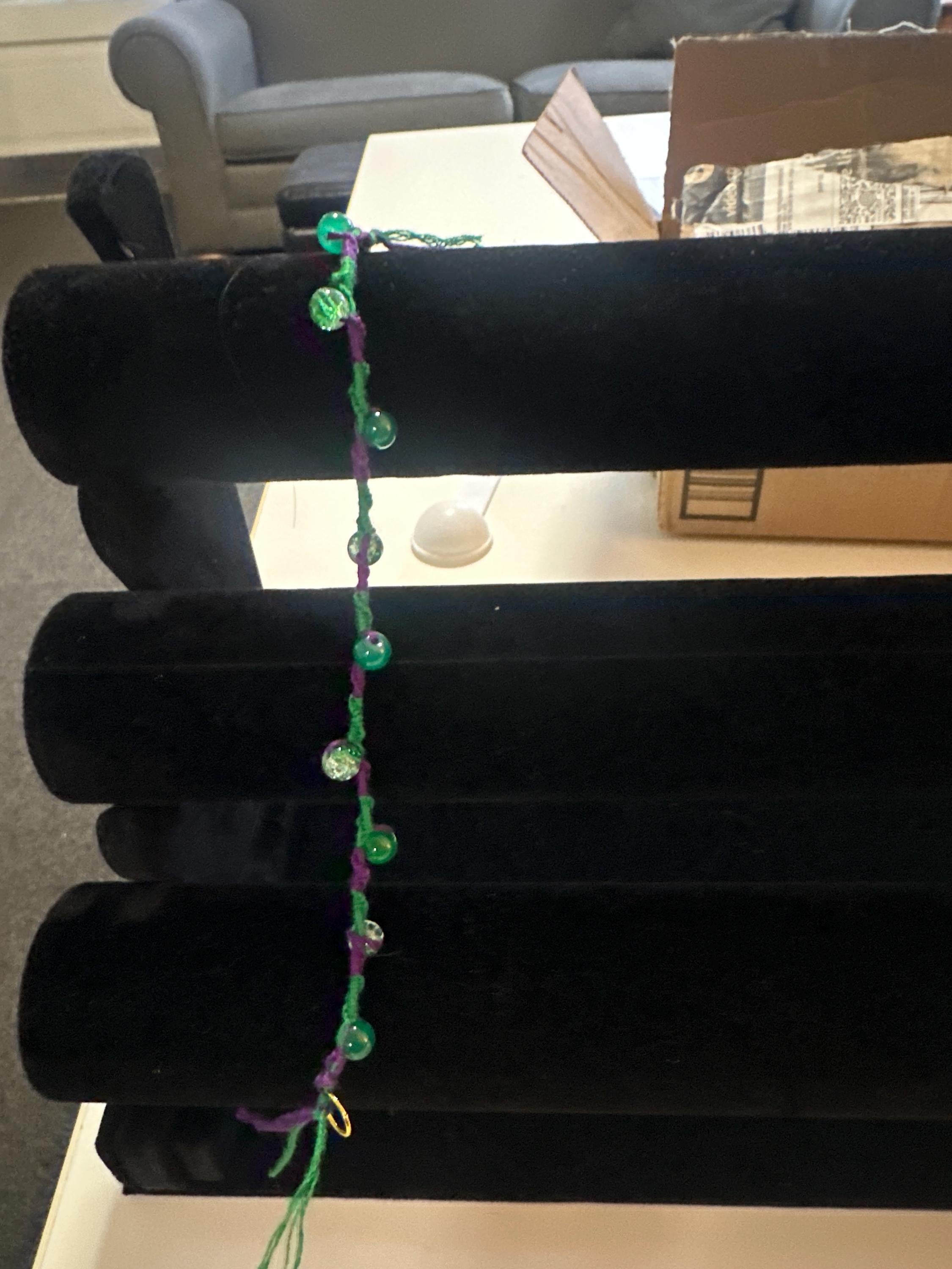 Spiral design bracelet with 9 glass baubles