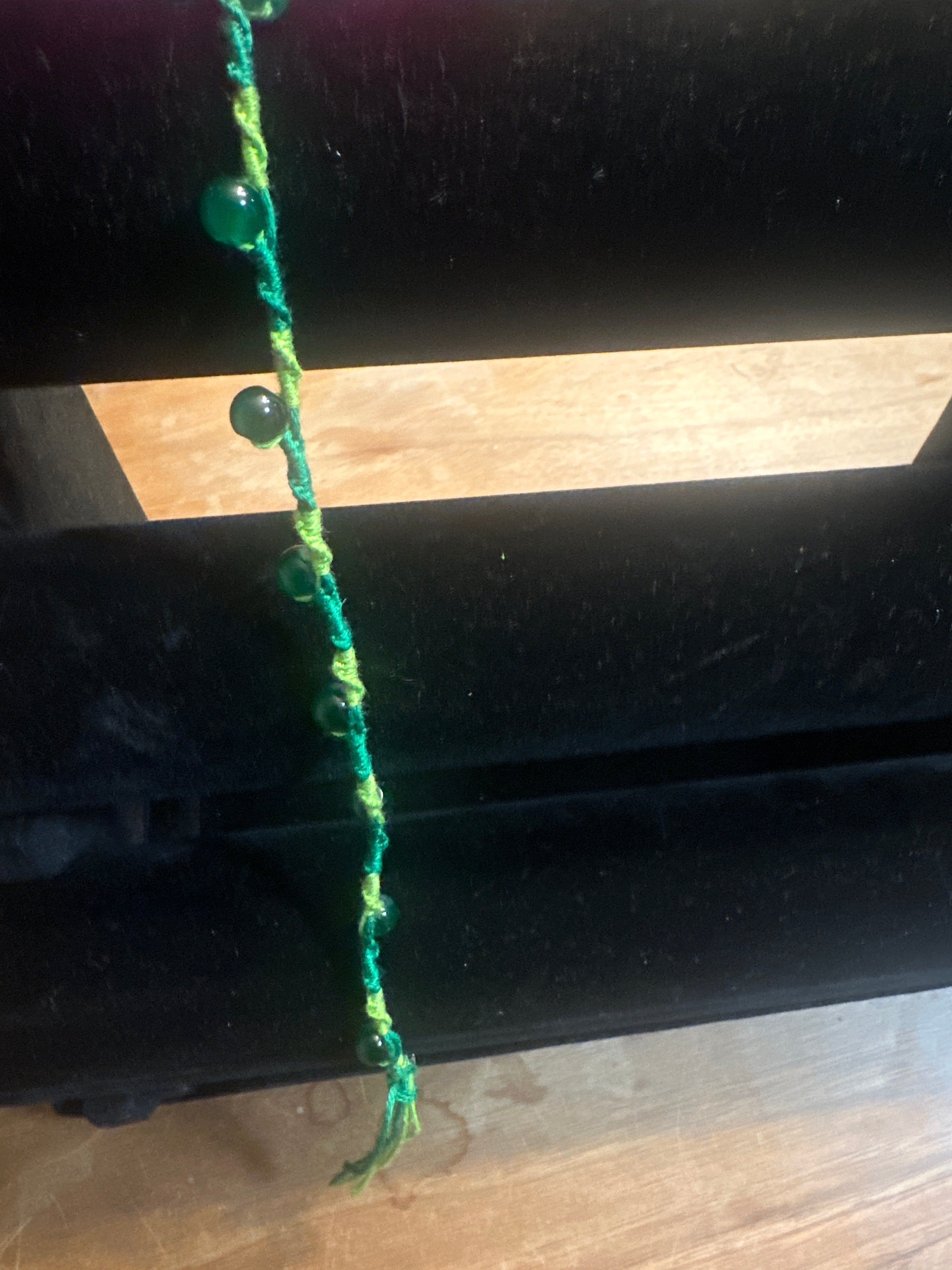 Spiral design bracelet with 9 glass baubles