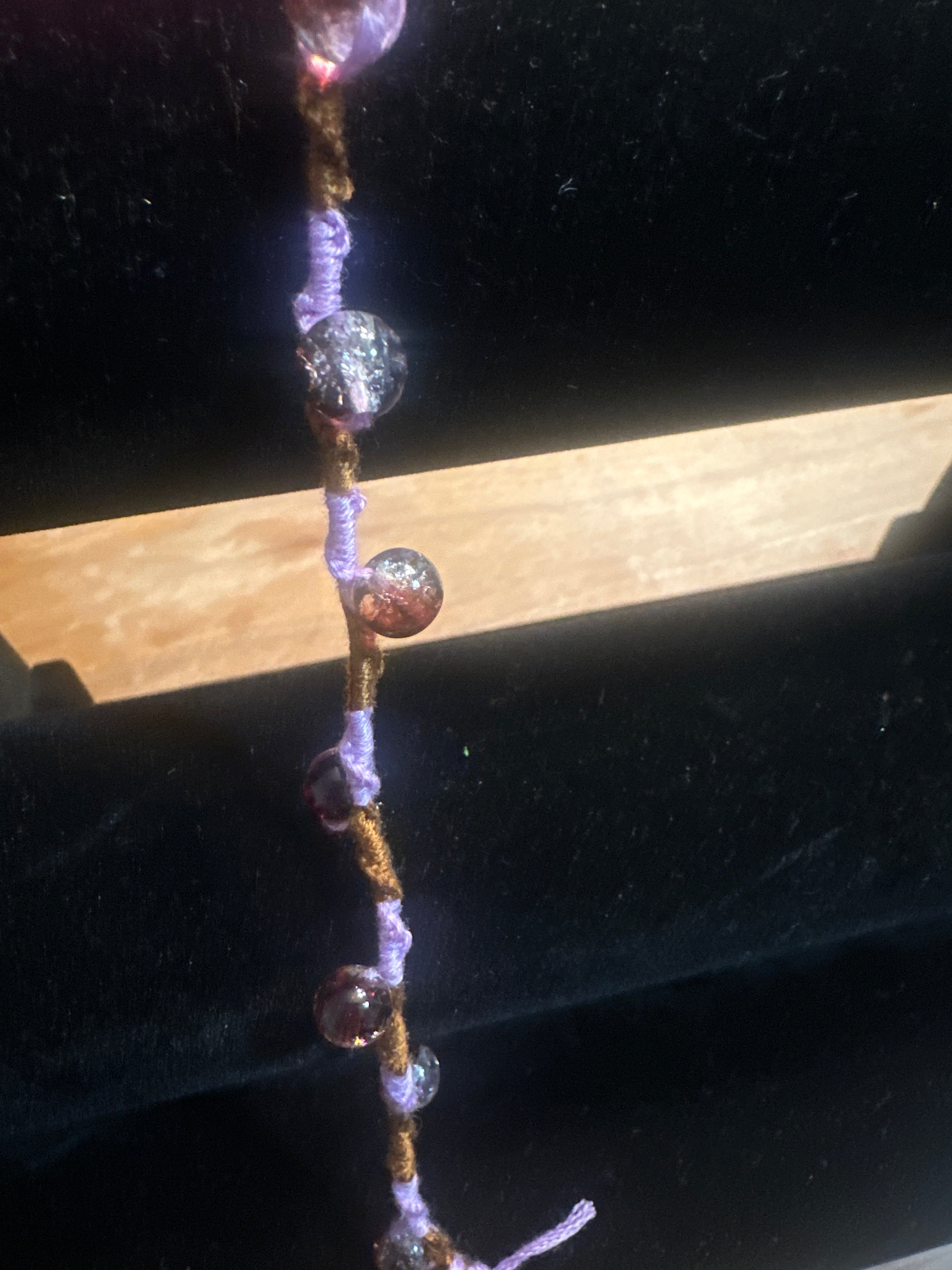 Spiral design bracelet with 9 glass baubles