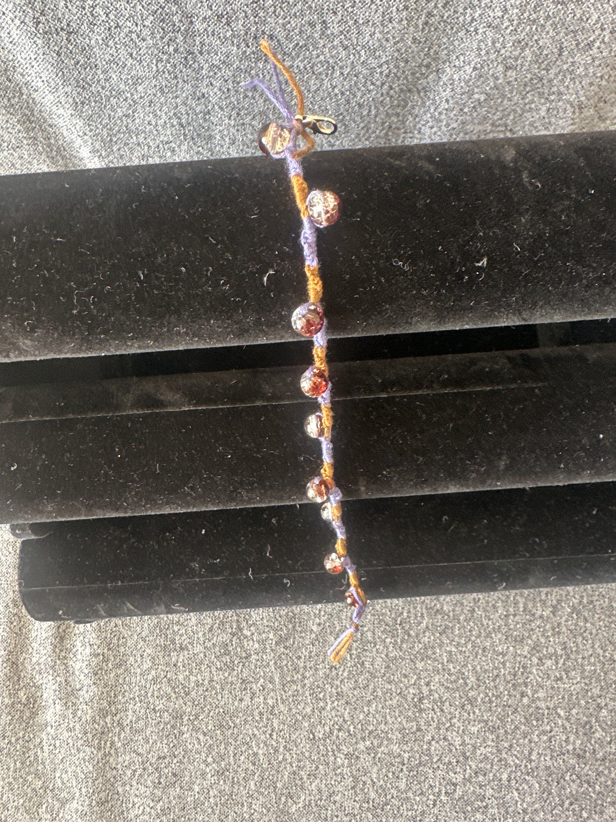 Spiral design bracelet with 9 glass baubles