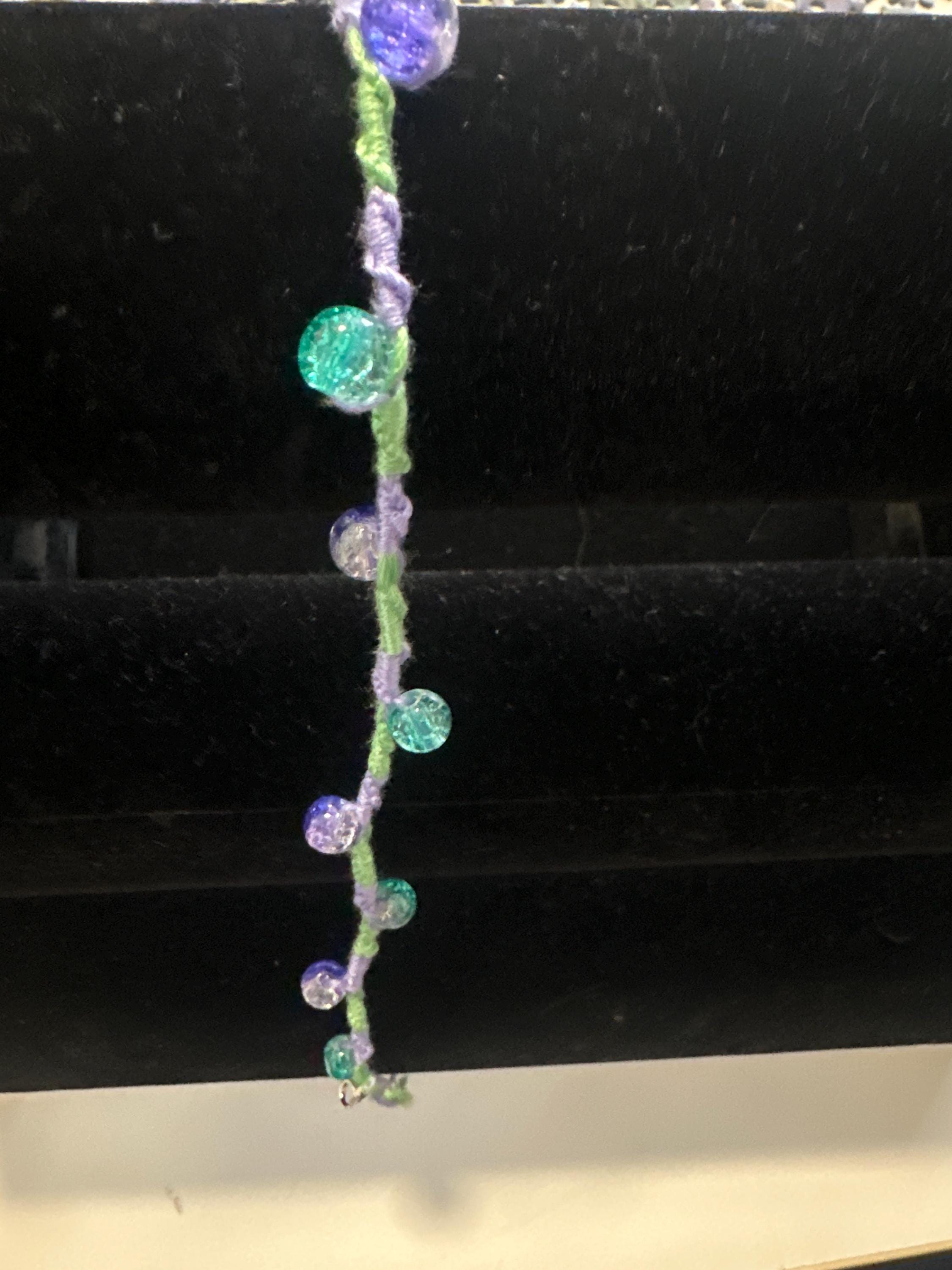 Spiral design bracelet with 9 glass baubles